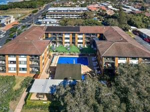 an overhead view of a house with a swimming pool at Sandcastles Holiday Apartments in Coffs Harbour
