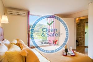 a sign that reads clean and safe in a hotel room at Quinta do Olival in Arcos de Valdevez