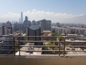 a large building with a view of the city at Departamentos Pontoni in Santiago