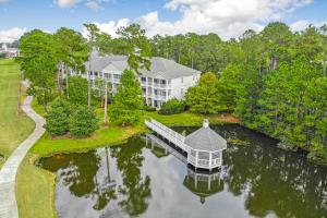 an aerial view of a large house on a lake at Grande Villas at World Tour Golf Resort in Myrtle Beach