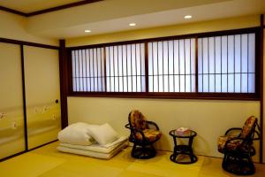 Giường trong phòng chung tại Tsurui Goshonishi 鶴居御所西