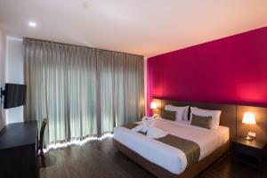 Postel nebo postele na pokoji v ubytování Coco View Hotel