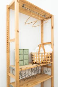 a wooden table topped with a basket filled with baskets at Picnic Dreams Boutique Hostel in Málaga