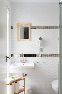 a bathroom with a sink and a mirror at Picnic Dreams Boutique Hostel in Málaga