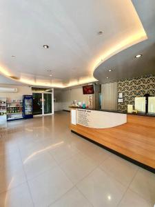 a lobby of a store with a counter and a counter at Better Place Hotel in Ubon Ratchathani
