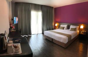 Postel nebo postele na pokoji v ubytování Coco View Hotel