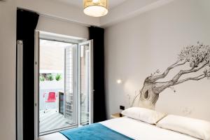 Letto o letti in una camera di BOTTASSO17 Guest House a due passi dal mare