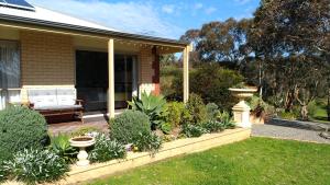 a porch of a house with a garden at Austiny Bed and Breakfast Victor Harbor in Victor Harbor