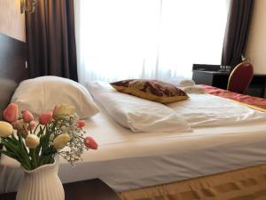 Postel nebo postele na pokoji v ubytování Atlas Berlin Hotel