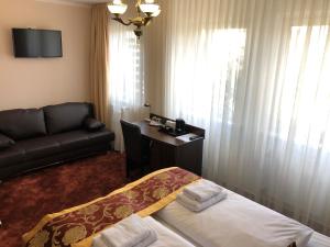 Postel nebo postele na pokoji v ubytování Atlas Berlin Hotel