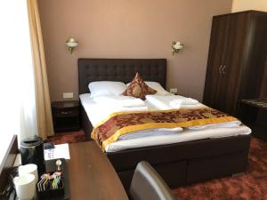 Postel nebo postele na pokoji v ubytování Atlas Berlin Hotel