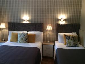 Katil atau katil-katil dalam bilik di The Gardens guest accommodation