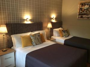 Katil atau katil-katil dalam bilik di The Gardens guest accommodation