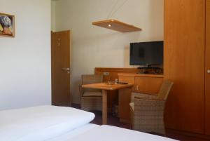 TV a/nebo společenská místnost v ubytování Hotel Gasthof Hereth