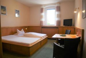 TV a/nebo společenská místnost v ubytování Hotel Gasthof Hereth
