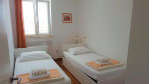 Ένα ή περισσότερα κρεβάτια σε δωμάτιο στο Apartments Laus