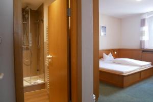 Postel nebo postele na pokoji v ubytování Hotel Gasthof Hereth