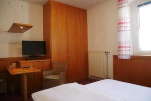 TV a/nebo společenská místnost v ubytování Hotel Gasthof Hereth