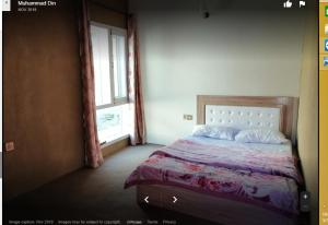 Postel nebo postele na pokoji v ubytování Darwesh Hotel Hunza