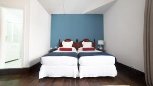 Postel nebo postele na pokoji v ubytování Hotel Aguere