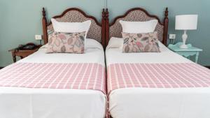 Postel nebo postele na pokoji v ubytování Hotel Aguere