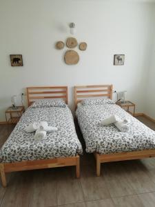Katil atau katil-katil dalam bilik di Casa Maria