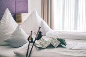 Postel nebo postele na pokoji v ubytování Hotel Restaurant Kochschule Rössle