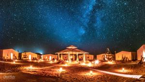 a starry night with the milky way at Aladdin Desert Camp - Mhamid Erg Chigaga Escape in El Gouera