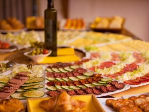 a table with many different types of food on it at Fornalutx Petit Hotel - Bed & Breakfast in Fornalutx +32 photos