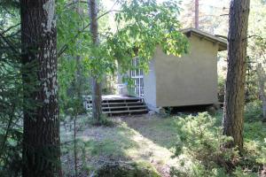 a small house in the middle of a forest at Sattmark EcoCabin in Pargas