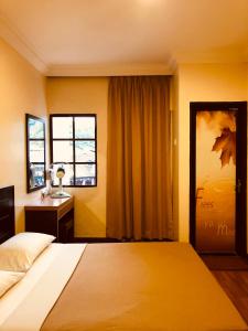 Postel nebo postele na pokoji v ubytování Hotel Chua Gin