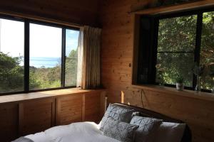 A bed or beds in a room at 屋久島シエスタYakushima Entire house with a wonderful view