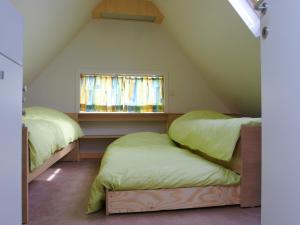 Giường trong phòng chung tại Holiday Home Op 't Busselen