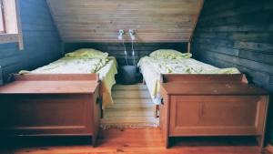 Кровать или кровати в номере Lombi Holiday House
