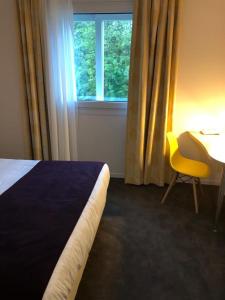 Postel nebo postele na pokoji v ubytování Le Manoir