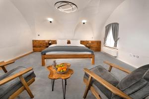 A bed or beds in a room at Boutique hotel & spa DOMA u nás - entry AquaCity free