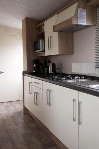 Kuchyň nebo kuchyňský kout v ubytování Beach Chalet Tranquilo + 5 fotografií
