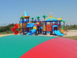a playground with a colorful playground at Beach Chalet Tranquilo in Petten