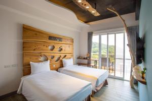 Llit o llits en una habitació de YUN-JIN Villa Matsu