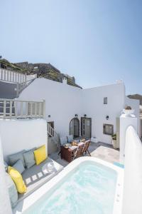 a pool on the roof of a house at Santorini 180 Degrees in Pyrgos