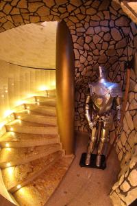 a statue of a knight standing next to a staircase at Wynajem Pokoi in Krynica Zdrój