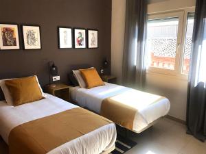 Postel nebo postele na pokoji v ubytování Apartamentos Élite - Art Collection - Pablo