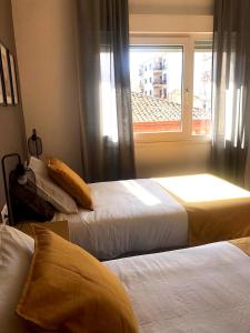 Postel nebo postele na pokoji v ubytování Apartamentos Élite - Art Collection - Pablo