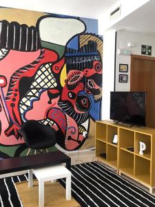 TV a/nebo společenská místnost v ubytování Apartamentos Élite - Art Collection - Pablo