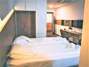 Krevet ili kreveti u jedinici u objektu Orange Hotel