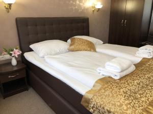 Postel nebo postele na pokoji v ubytování Atlas Berlin Hotel