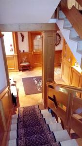 a hallway with a staircase in a house at Garni Toni in Ortisei