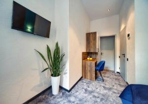 TV a/nebo společenská místnost v ubytování Hotel Buninn