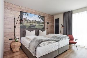 Postel nebo postele na pokoji v ubytování Genusshotel Wenisch