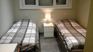 Postel nebo postele na pokoji v ubytování Arconaty Hotel